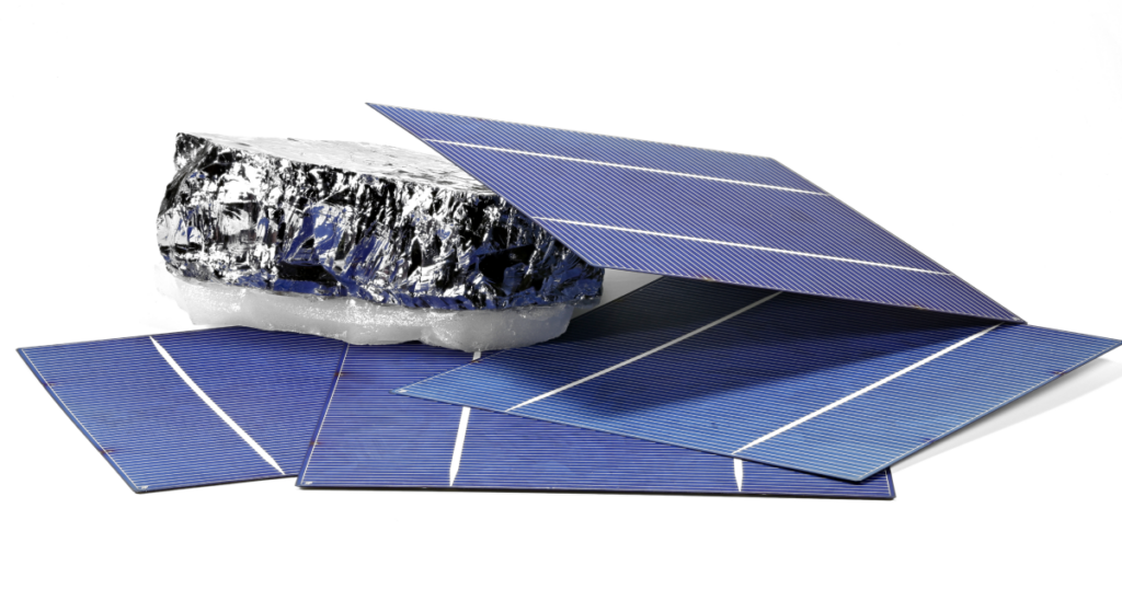 An image showing the high-risk commodity polysilicon. A silvery rock is shown with components of a solar panel. 