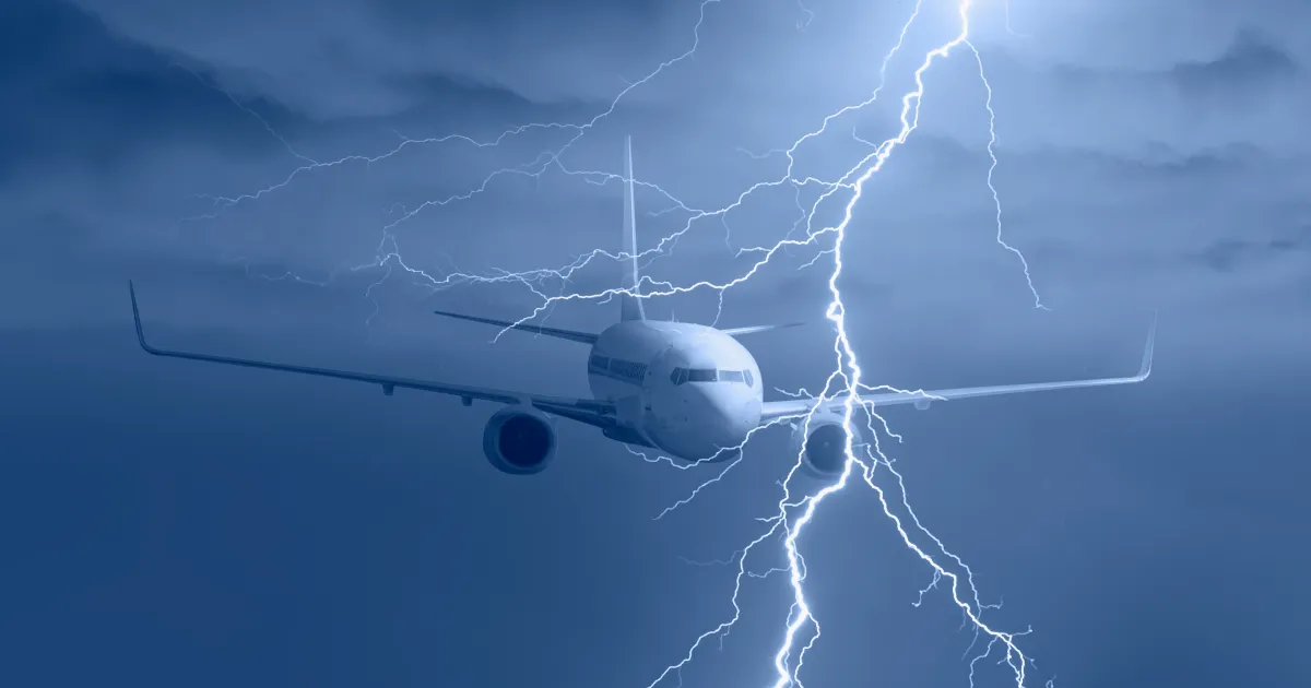 A picture of an airplane flying through a storm.